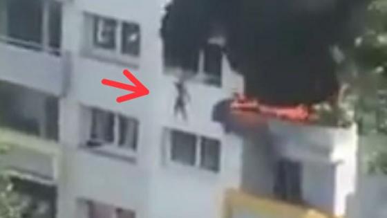 saltan de un edificio en llamas