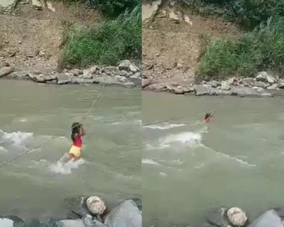 Niña indígena arriesga su vida para cruzar un río en Risaralda