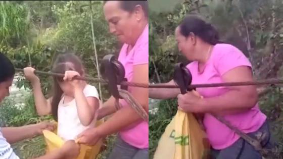 Niños cruzan río en garrucha en Granada, Antioquia