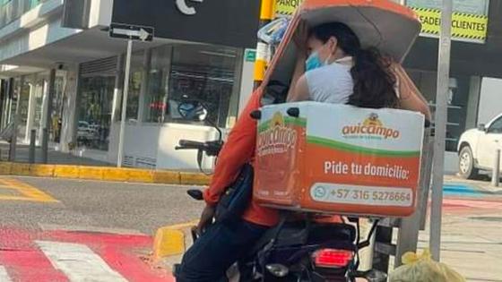 mujer pollos buaramanga motocicleta domiciliario