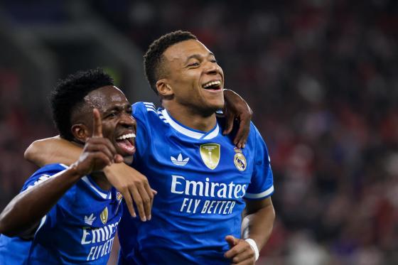 Real Madrid's Kylian Mbappe (R) celebrates after scoring a goal during the UEFA Champions League league phase soccer match between Olympiacos FC and Real Madrid in Piraeus, Greece, 26 November 2025.